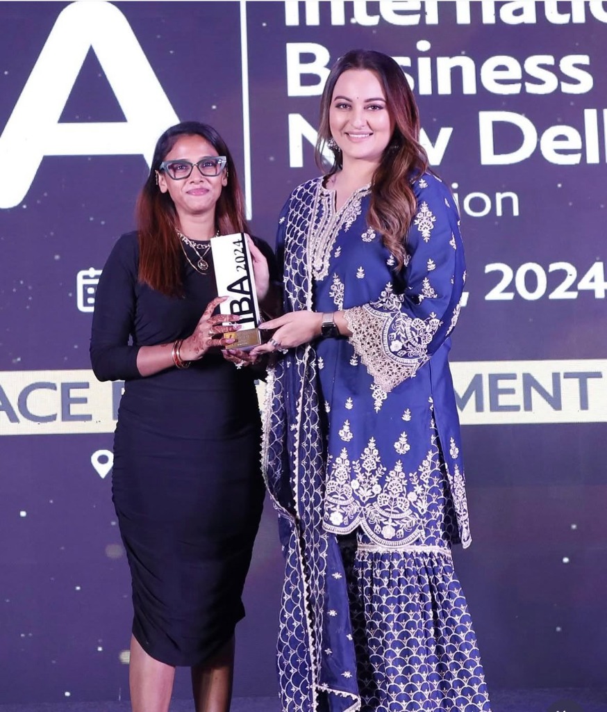 Bollywood Actress Sonakshi Sinha presenting award to winner