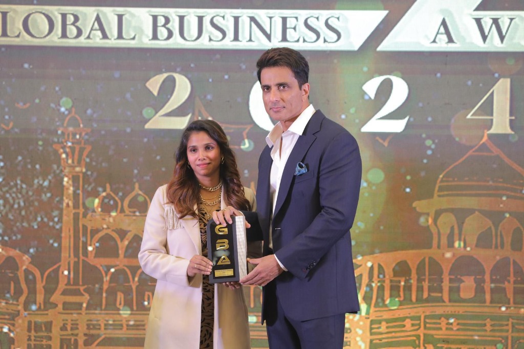 Bollywood Actor Sonu Sood presenting award to winner