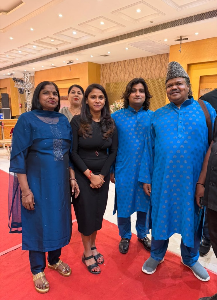 Honoured corporate leaders and guests standing on the prestigious red carpet conclave
